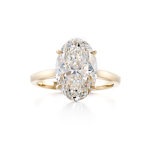 A solitaire style engagement ring with a 18 karat yellow gold band and a 5.01 carat oval cut center stone that is an H color and VS2 clarity according to GIA.